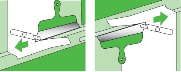 Les dessus et les dessus sont garnis d'un couteau de bureau tranchant sur une règle ou une spatule large lorsque le papier peint sèche Les dessus et les dessus sont garnis d'un couteau de bureau tranchant sur une règle ou une spatule large lorsque le papier peint sèche