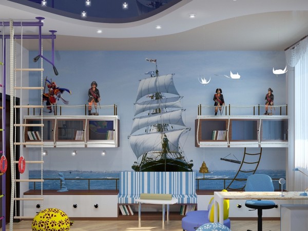 Sur la photo, la chambre des enfants d'un jeune pirate, avec des peintures murales pour les garçons avec l'image d'une frégate rapide contre la mer bleue et le ciel Sur la photo, la chambre des enfants d'un jeune pirate, avec des peintures murales pour les garçons avec l'image d'une frégate rapide contre la mer bleue et le ciel